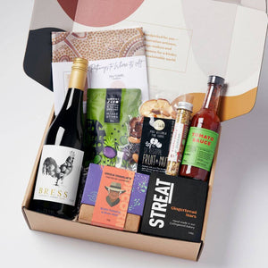 Australian summer hamper with artisan gourmet treats, Indigenous-owned products, organic cotton art tea towel, wine, and local delicacies. A perfect ethical gift for summer celebrations.