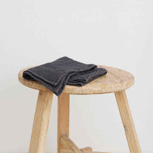 Generously sized 100% organic cotton waffle weave hand towel, handwoven by Fair Trade women’s cooperative in southern India, offering softness and absorbency with traditional craftsmanship