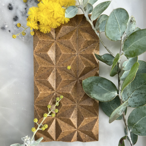 First Nations chocolatier Loco for Cocoa crafts silky milk chocolate infused with roasted wattleseed, butterscotch, and caramel toffee in the Wattle Seed Dreaming bar.