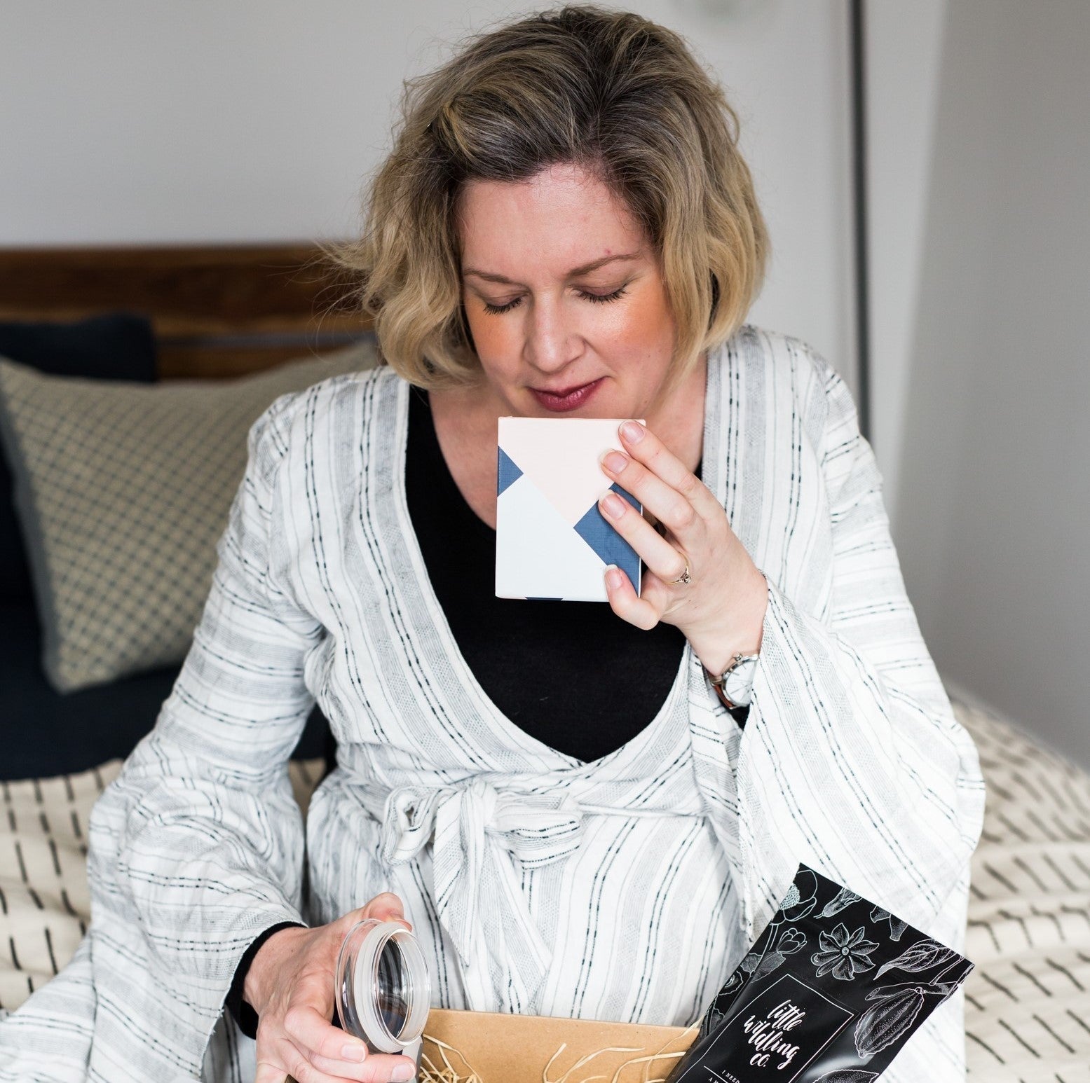 A curated selection of ethically sourced Mother’s Day gifts beautifully arranged in sustainable packaging, including artisan chocolates, natural bath products, eco-friendly nail polish, and handcrafted teas, all celebrating self-care and social impact.