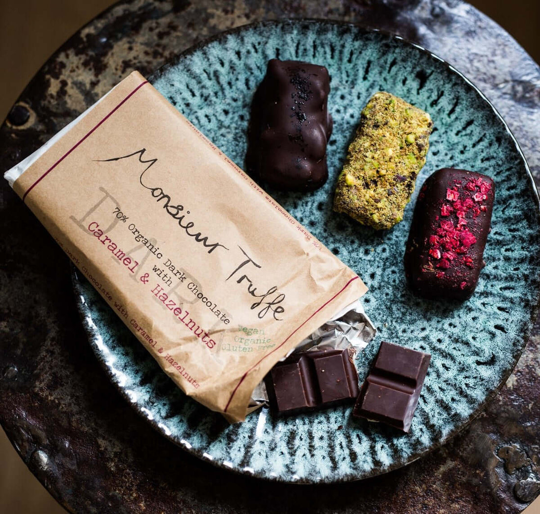 Vegan Chocolate Therapy Hamper featuring ethical artisan chocolate, vegan macadamias, and a reusable HuskeeCup.