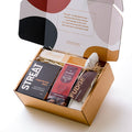 Artisan Christmas hamper with spiced gingerbread stars, salted caramel fudge, almond nougat, and chocolate-coated fruit and nuts