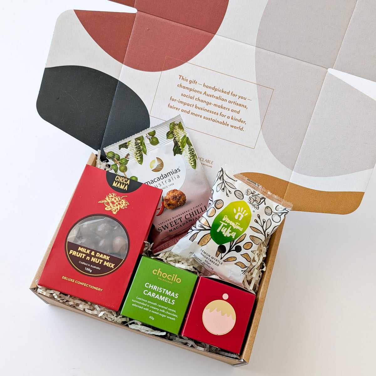 Christmas gift hamper with chocolate, shortbread, macadamias, and Indigenous-made treats
