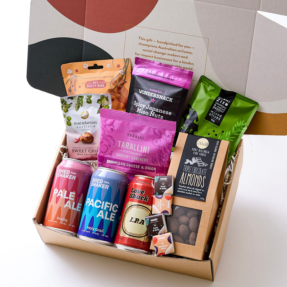 A hamper with Aussie-made brews, spicy nuts, olives, gourmet popcorn, chocolate bites, and more. Perfect for a BBQ or laid-back gathering.
