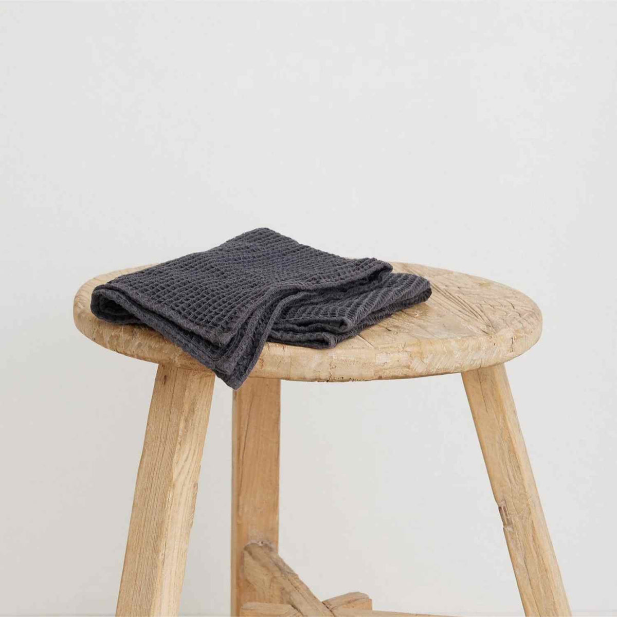 Generously sized 100% organic cotton waffle weave hand towel, handwoven by Fair Trade women’s cooperative in southern India, offering softness and absorbency with traditional craftsmanship