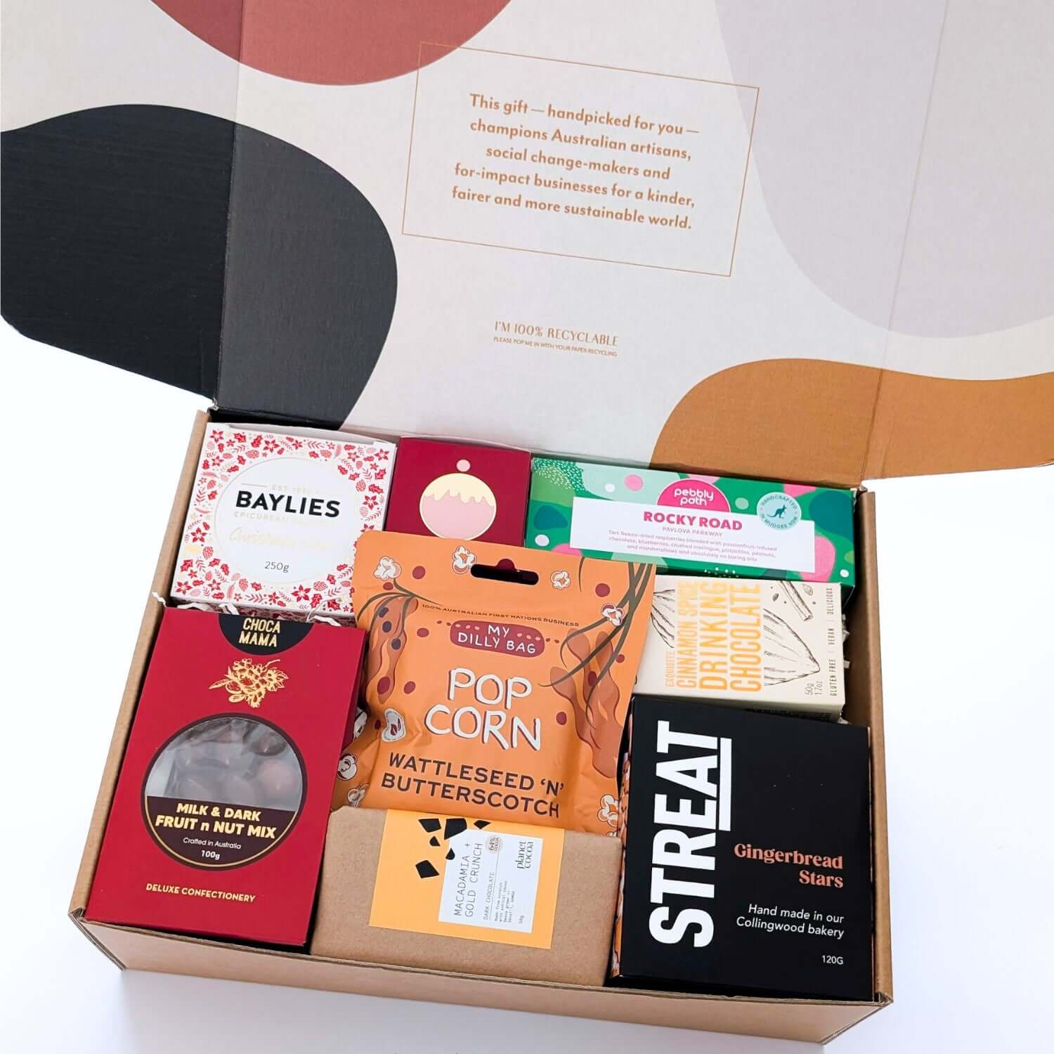 Christmas hamper with artisan treats including chocolates, gingerbread, fruitcake, and vegan options