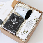 Goddess gift hamper with artisan ceramic cup, organic herbal tea, and natural hydrating body cream.
