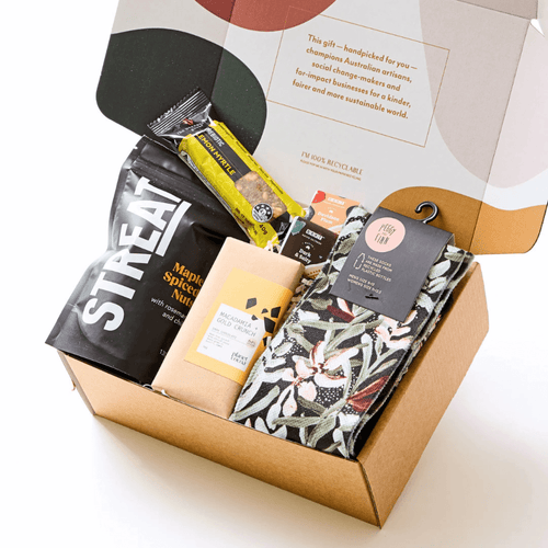 Men’s gift bundle with recycled green socks, maple spiced nut medley, vegan chocolates, indigenous prebiotic bar, and native ingredient chocolate bites