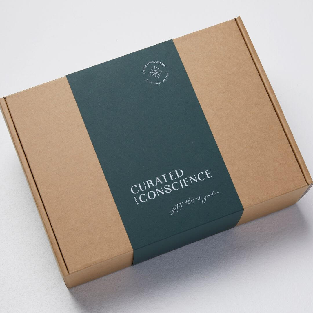 Front view of the Curated With Conscience hamper featuring eco-friendly packaging materials