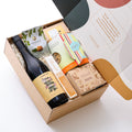 Artisan gift hamper with Yarra Valley Pinot Noir, French vanilla meringue kisses, roasted macadamias, vegan chocolate, vanilla bean shortbread, and gluten-free almond nougat. A thoughtful thank-you gift.