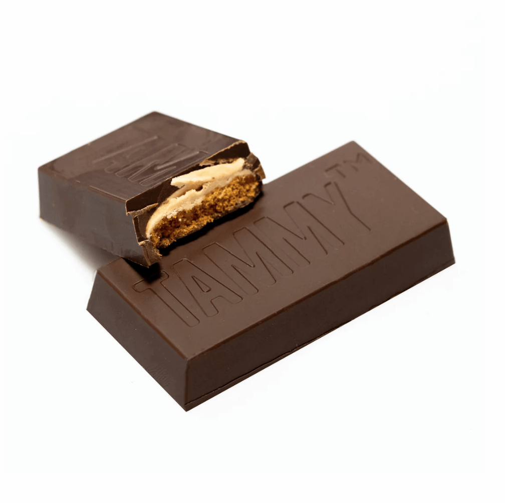 Vegan chocolate-coated cinnamon biscuits with hazelnut filling, a plant-based take on a classic Aussie treat by Vegan Chocolate Co